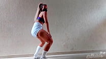 Blonde girl dancing in glued shorts