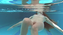 Irina Russaka strips naked in the swimming pool