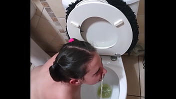 Pigtailed teen sucks dick after being pissed on and licking the toilet clean | face spitting and slapping