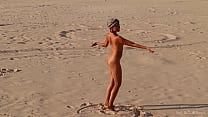 Sofi. Naked girl dancing among the sands
