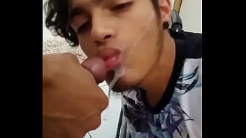 Gay wheelchair user bathing milk on his face