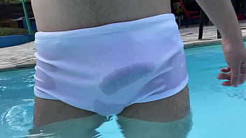 Hard dick with the see-through swim trunks in the club pool