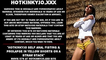 Hotkinkyjo self anal fisting & prolapse in yellow shorts on a straw stack