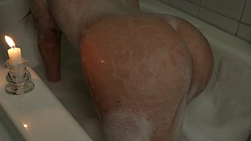 A Slender Beauty Takes a Bath With Foam Caressing  Pussy.