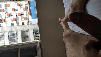 Full naked masturbation with open legs in front of many window