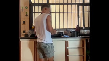 Young guy comes home from school with punishment and washes the dishes, and enjoys it a lot
