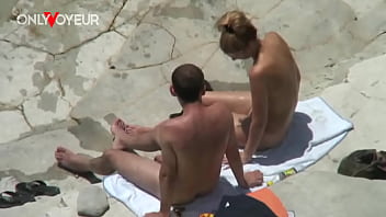 Beach Voyeur. Naughty young couple quick fuck on a rocky beach